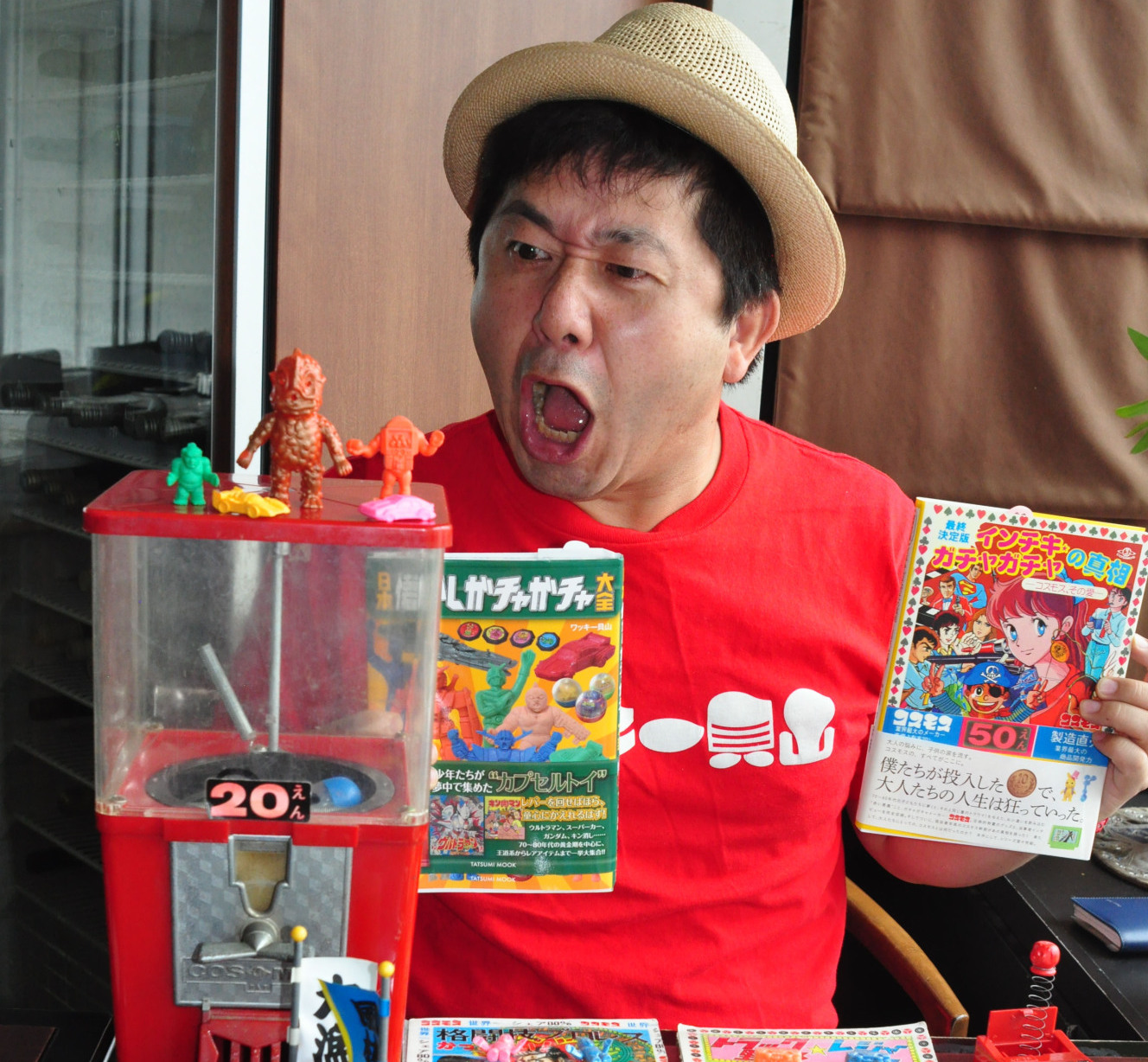 excited guy showing off gachapon toys